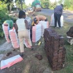 Clients packing products in sacks for construction