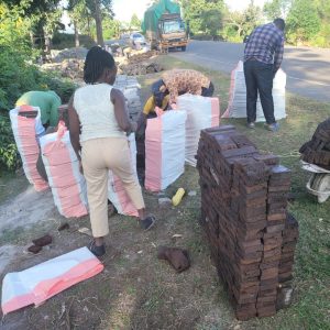 Clients packing products in sacks for construction